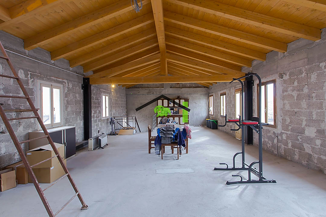 Mansarda open space travi legno